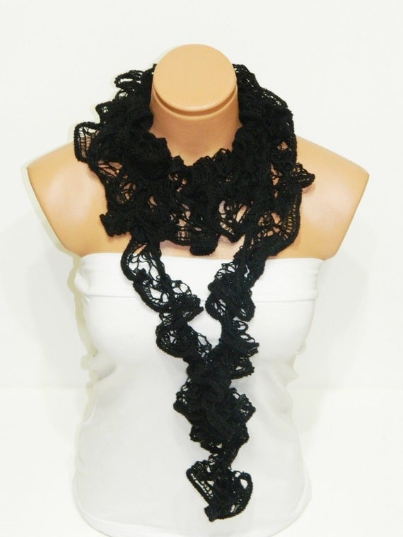 The scarf is knitted with black, soft yarn. Long scarf. Romantic. For her. HAND MADE.
