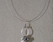 Necklace, charms and a Peacock feather, wire necklace