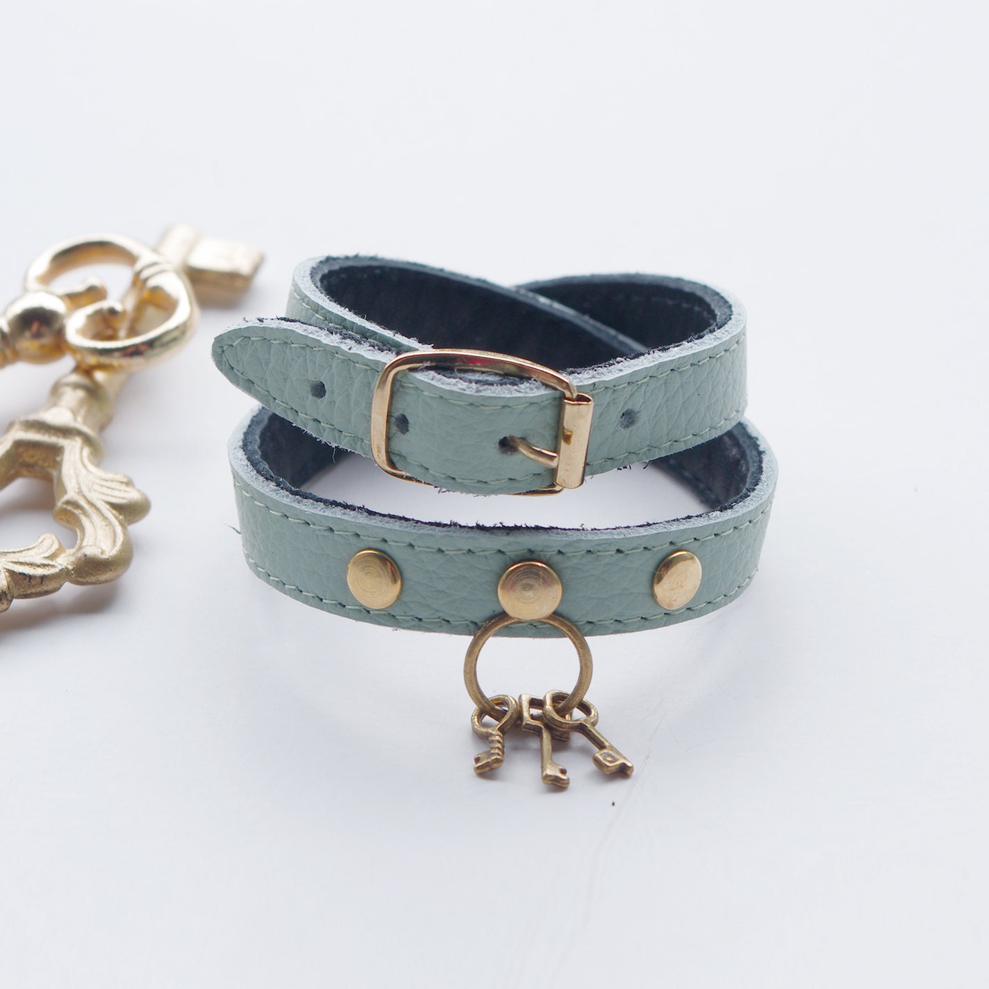 Lt. turquoise double tour leather bracelet with key charm