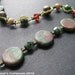 Red Earth Y Necklace. Green Brown and Scarlet Beaded Coin Trio Pendant