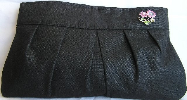 Clutch purse in quilted black