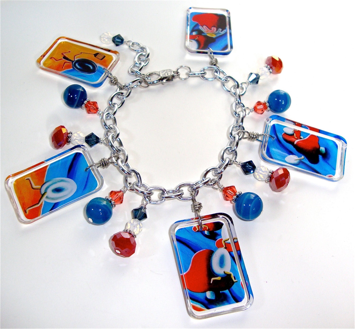 Resin charm bracelet with embedded art print and natural gemstones, title: Scrambling Eggs - resin jewelry