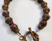 Goldstone beaded bracelet with copper accents