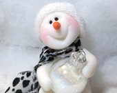 Can I help with the tree. Snowman ornament