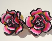 small pink black white and maybe yellow polymer clay flower pierced post earrings