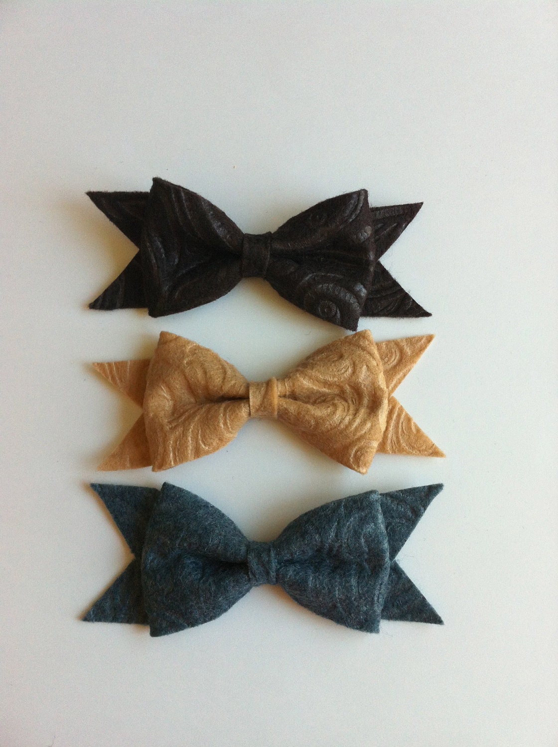 Set of 3 textured felt bows in grey, tan, and dark brown