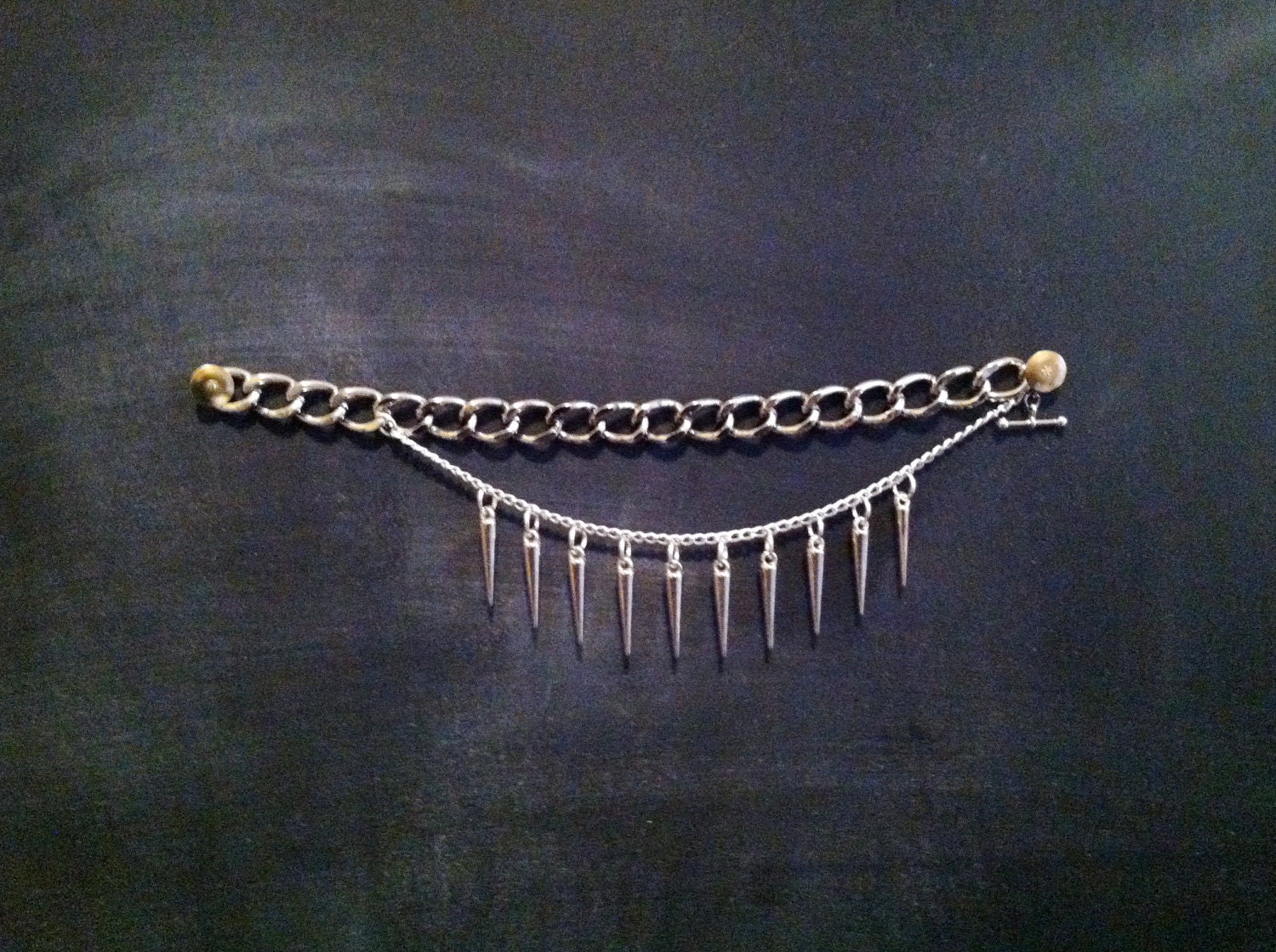 silver spike and multichain bracelet