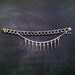 silver spike and multichain bracelet