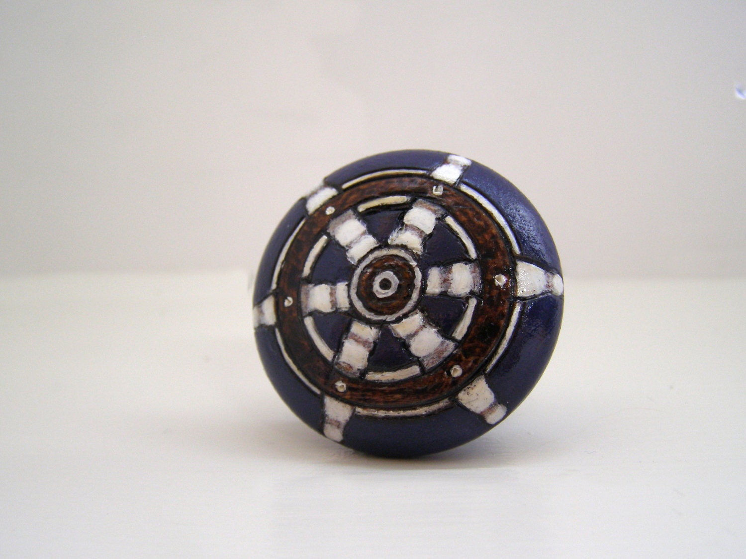 Burned and painted wooden cabinet knob - ship wheel, navy blue