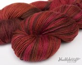 Red, orange, brown handpainted sock yarn: CATCHING FIRE on Blue-Faced Leicester/nylon fingering, 4 oz