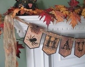 Victorian Inspired HAUNTED" Halloween Banner featuring Gothic Style Lettering with Spiders & Bats