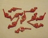 Destash of red plastic gun charms