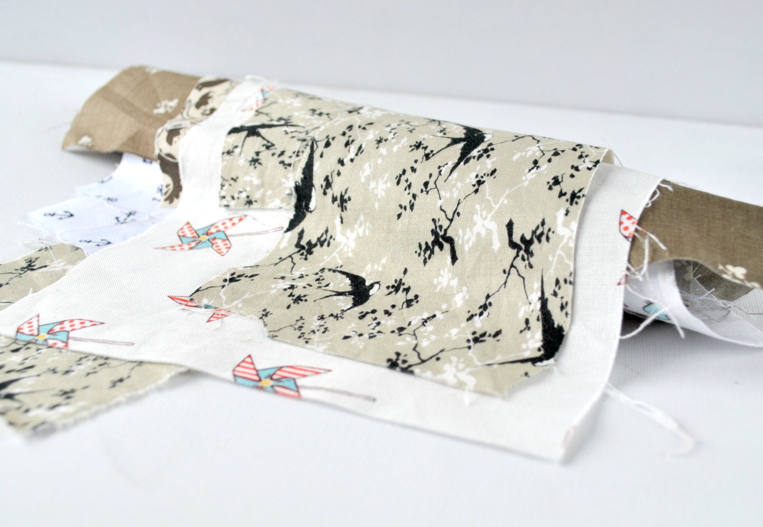 Quilting cotton fabric designer scrap roll White and neutral tones.