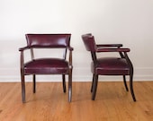 Pair of Vintage Cordovan Captains Chairs with Brass Nailhead Trim