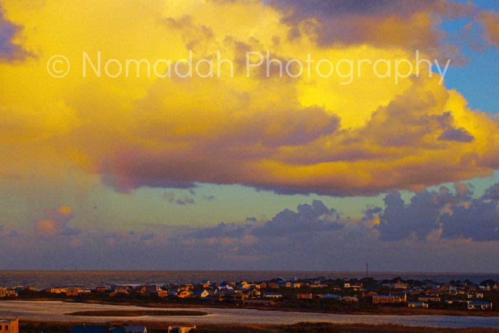 Cloud over seaside village, yellow cloud, dramatic sky, Betty's Bay, South Africa, yellow and blue, landscape photography