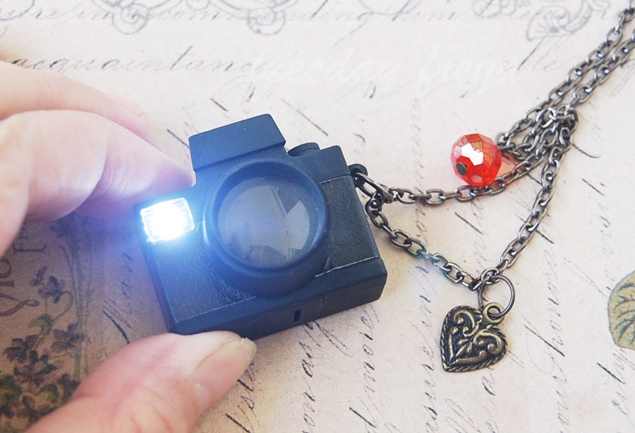 Loving lomo - a Holga mini camera necklace with actual flashing light and shutter sounds