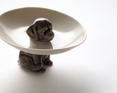 The dog bowl, porcelain bowl held up by a cute dog