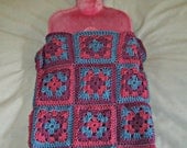 Hot water bottle cover made with pink, blue and purple granny squares