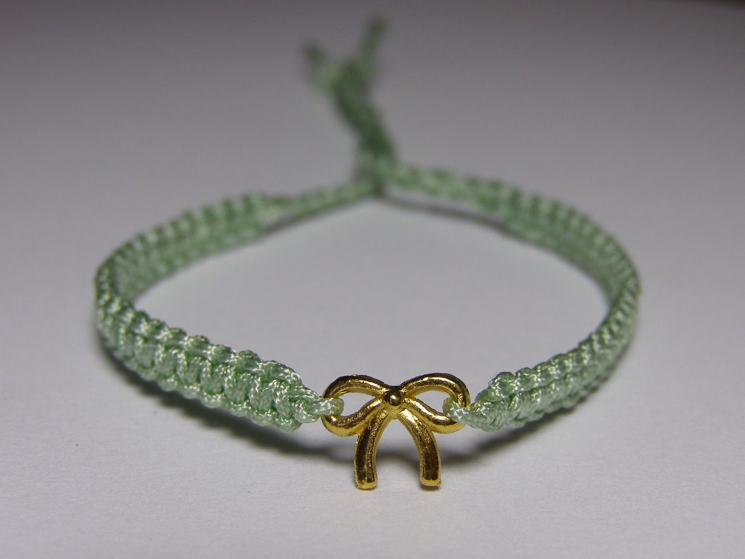 Bracelet with a tiny golden bow