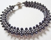 Triangular Teardrops: A bead woven diamond stitch bracelet with magatama beads