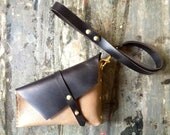 Taupe and black holster clutch