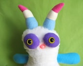 Monster toy stuffed animal plush with striped horns