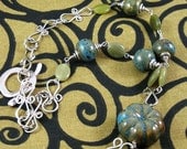 Squash blossom ceramic and serpentine silver statement necklace