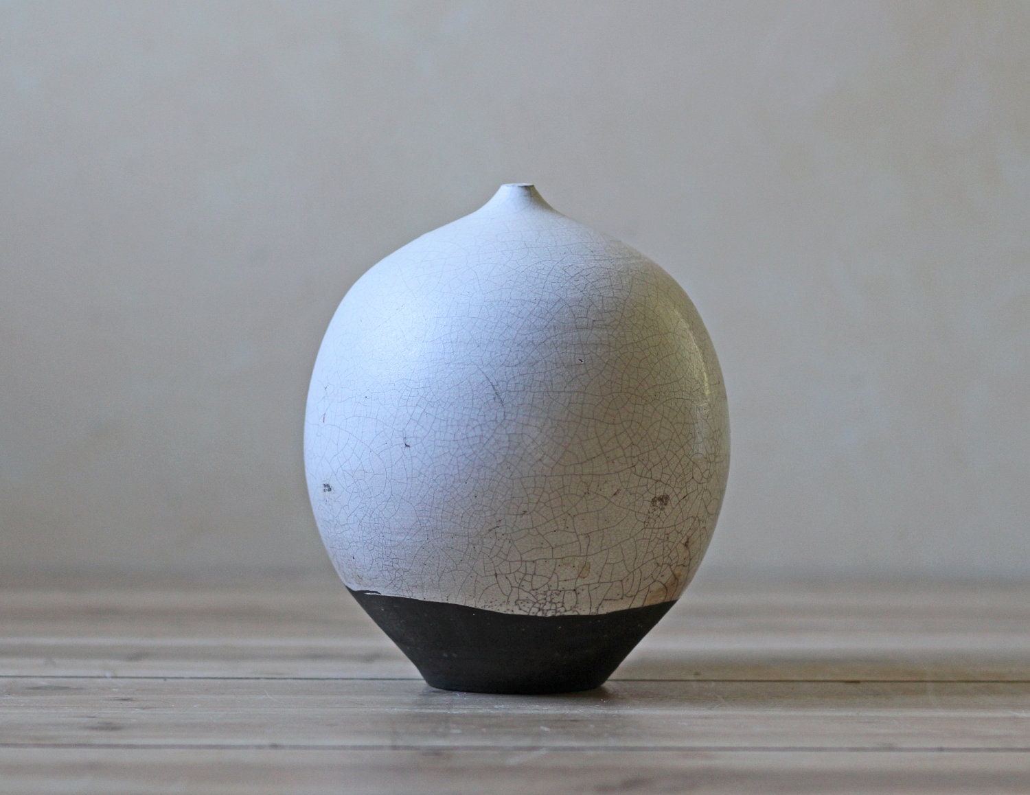 creamy white egg shaped studio pottery vase