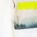 forest green backpack with neon yellow pouch