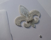 White beaded Fleur-de-Lis