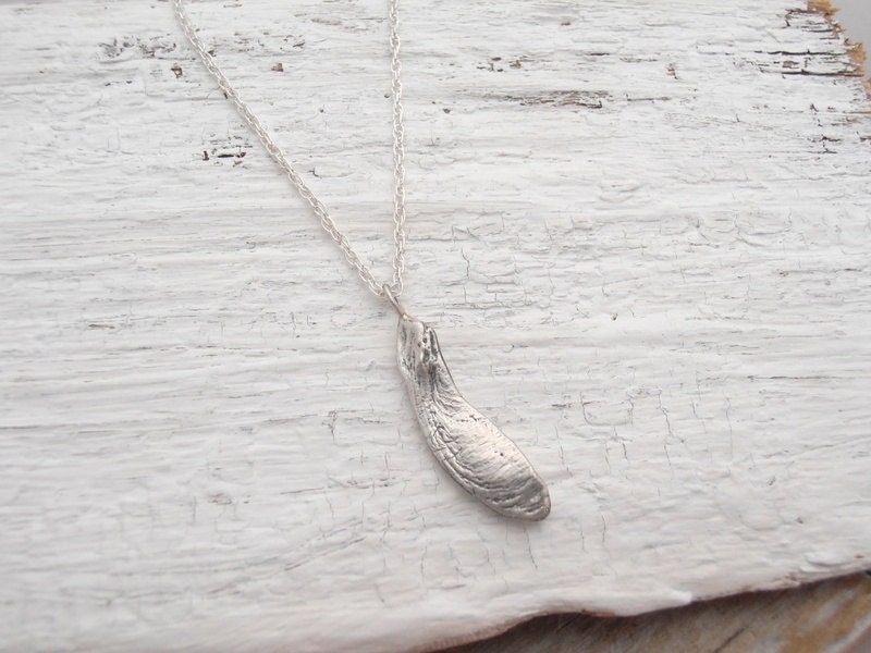 Single maple seed necklace is sterling silver