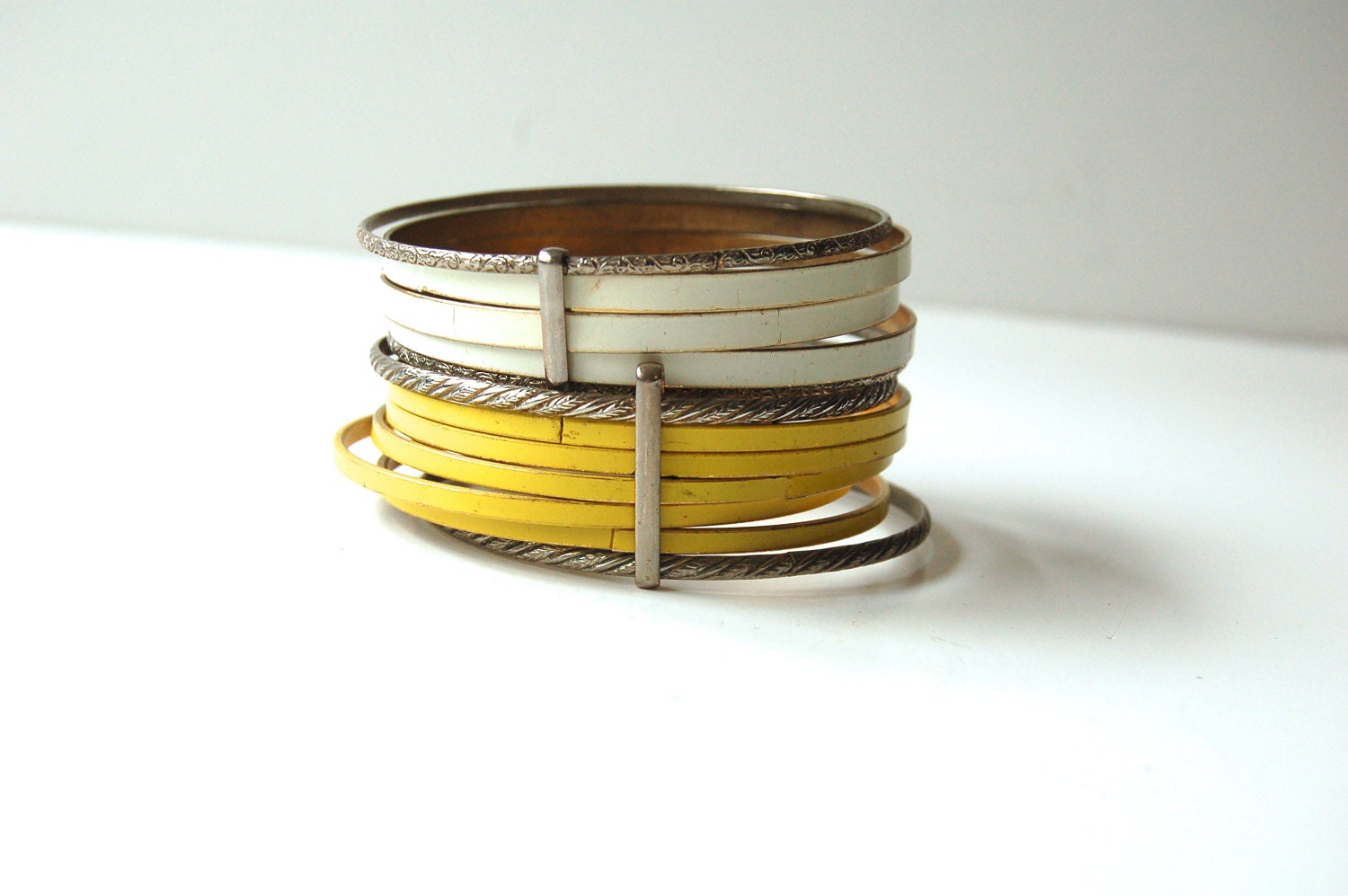 vintage stacking BRACELETS. metal and enamel. WHITE and YELLOW