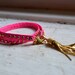 studded pink neon genuine leather & gold double wrap bracelet with gold tassel