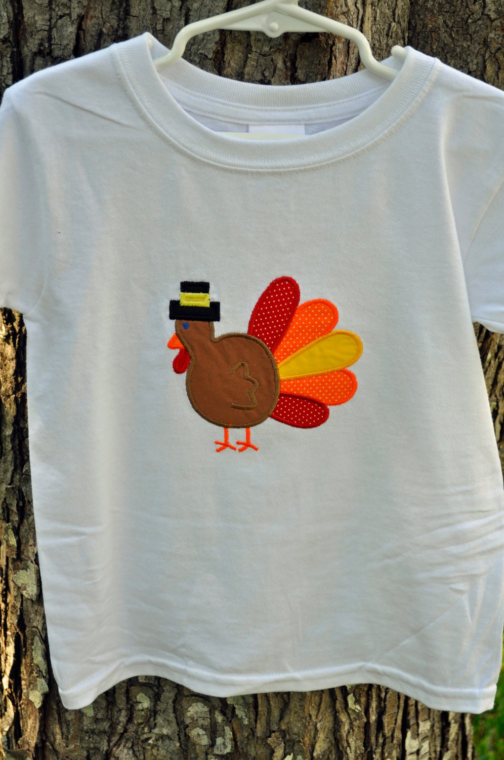 Thanksgiving turkey applique on child's Tshirt - name can be monogrammed on front