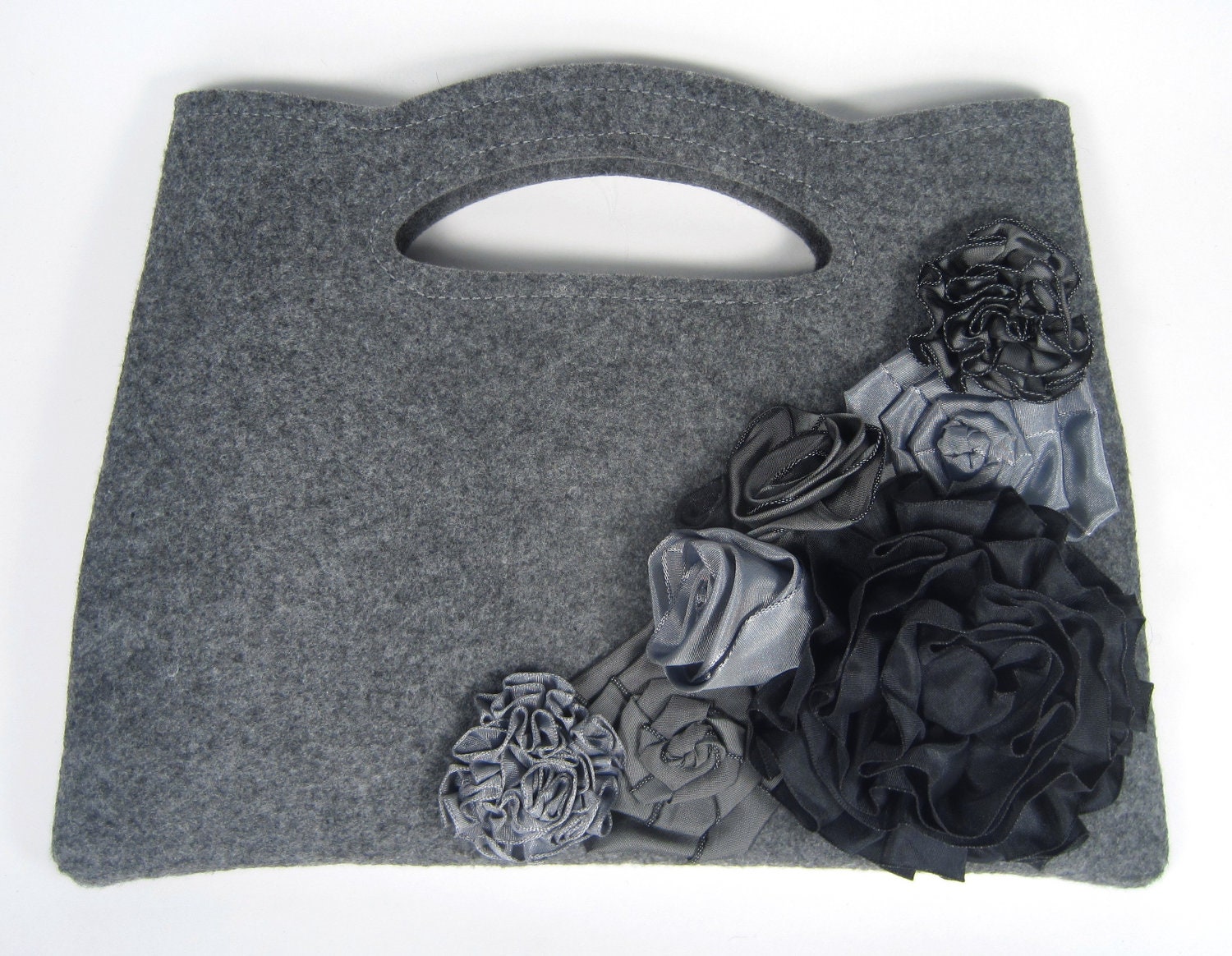 Gray clutch purse adorned with individually handmade ribbon roses and flowers