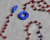 Currant and Huckleberry bead crocheted wrap necklace with deep blue gemstone flower toggle clasp