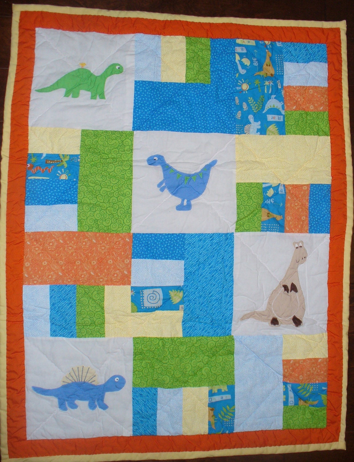 Orange, Blue and Green Dinosaur Nursery Quilt - HANDMADE and HAND QUILTED