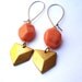 Coral and brass dangle earrings