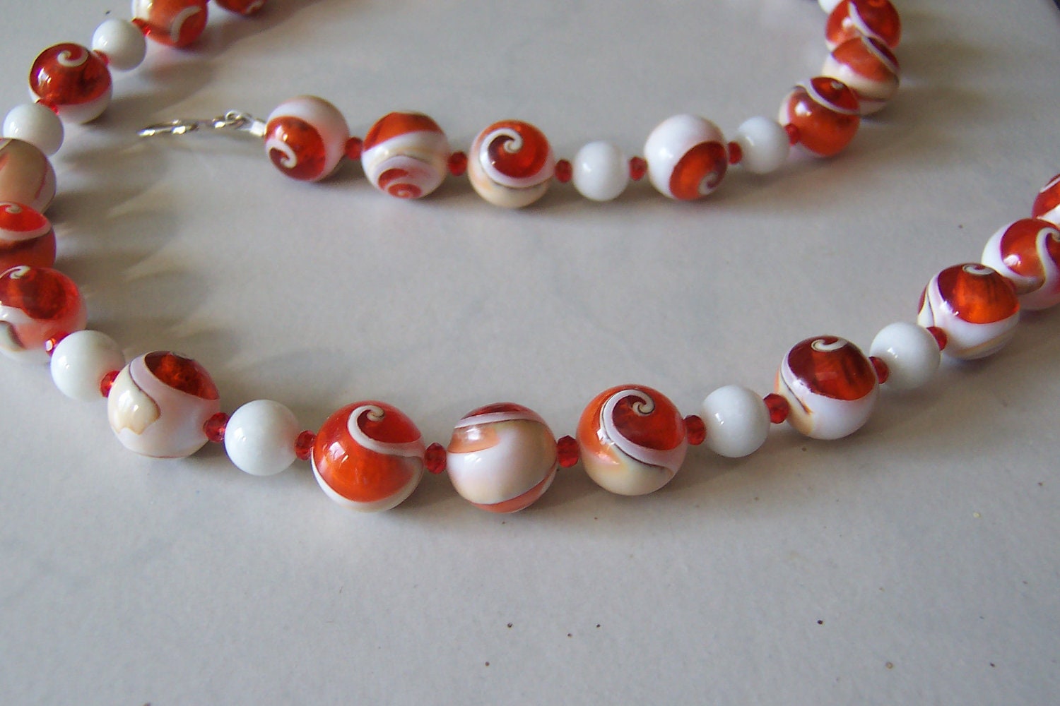 Orange and White Spiral Shell Filled with Glass & Mountain Jade Necklace