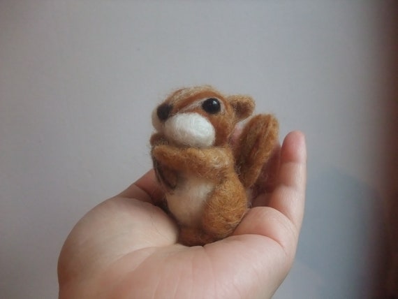 Needle felted squirrel with a nut