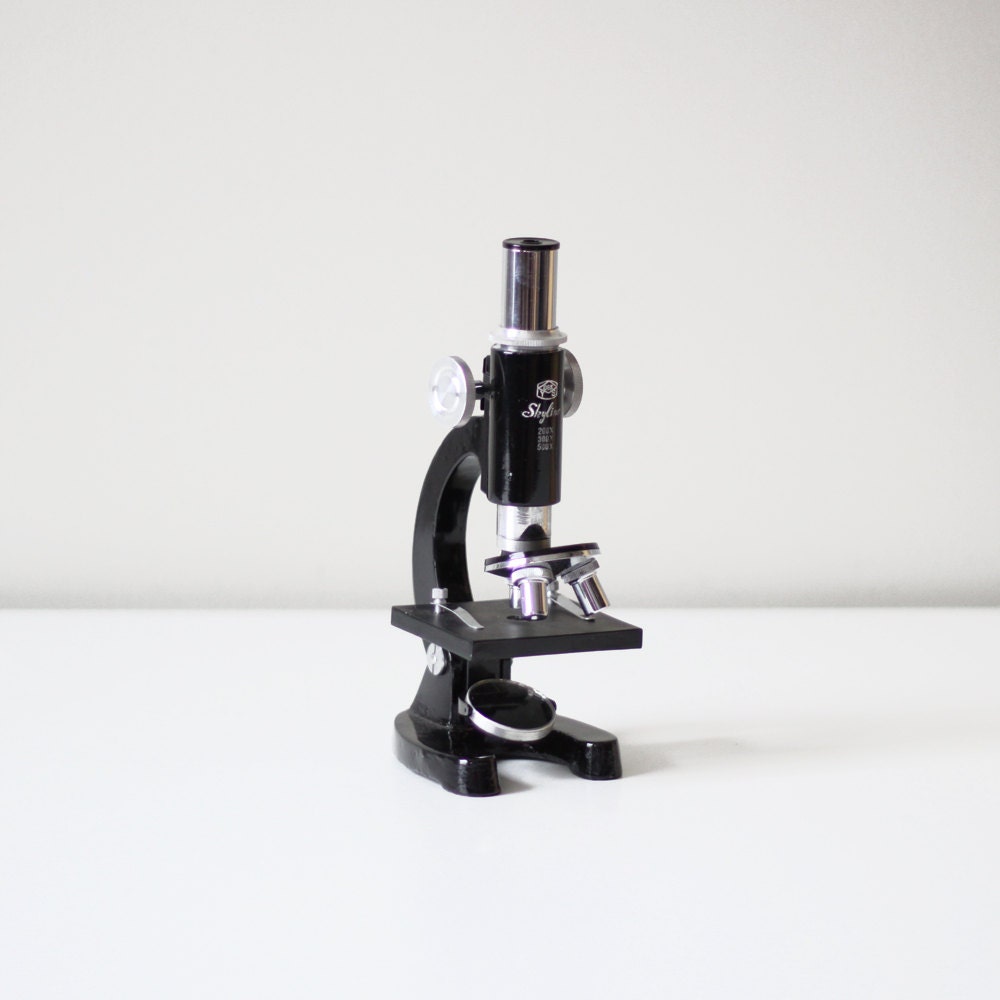 vintage skyline black microscope with cabinet