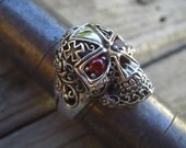 Skull ring in sterling silver with fiery orange cz's