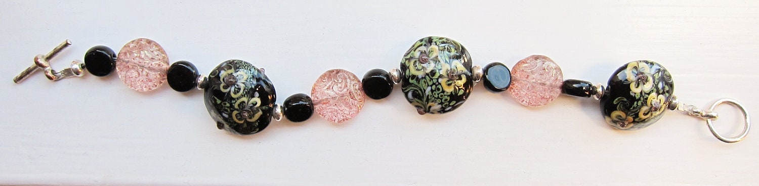 Green and pink glass lampwork bracelet - pastel - spring - circles black silver swirls yellow