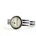 Unisex cuff bracelet for man or woman in shiny gunmetal black adjustable made with vintage sheet music uplifting word strong