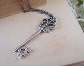 Aged silver vintage style skeleton key charm necklace