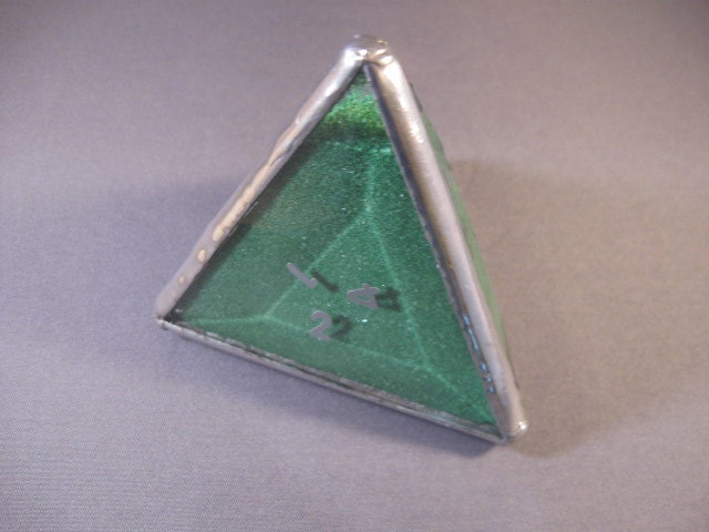 d4 paperweight in beveled glass filled with colored sand