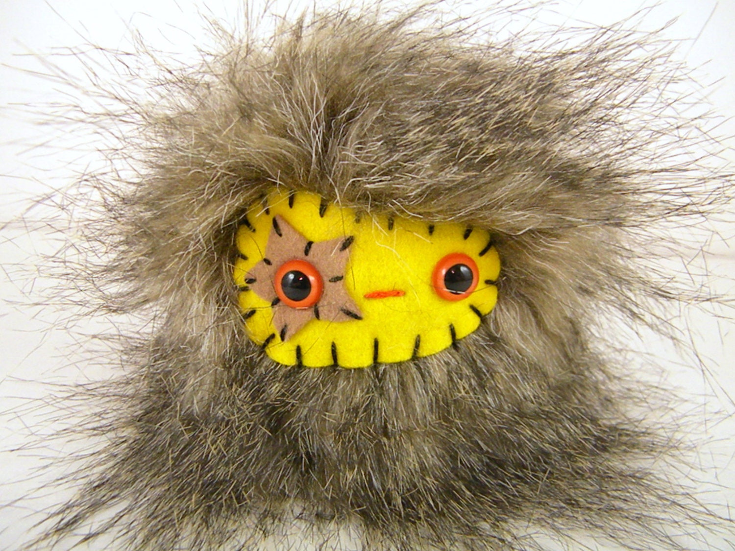 Woody the plush monster brown and yellow Poppumm stuffed animal