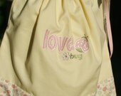 Love bug Pillowcase dress Yellow with multi colored dots Appliqued with a ladybug and the Love bug wording