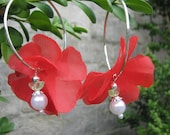 Red flower earrings with an angel