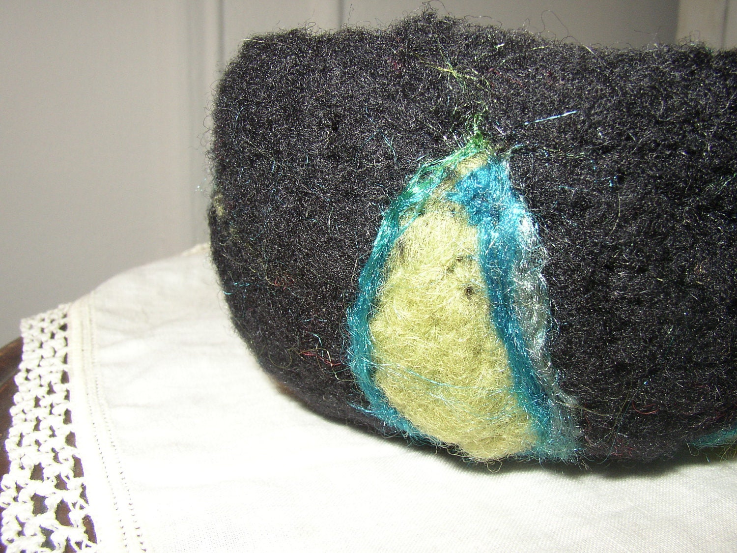 little black wool needle felted bowl with avocado slices